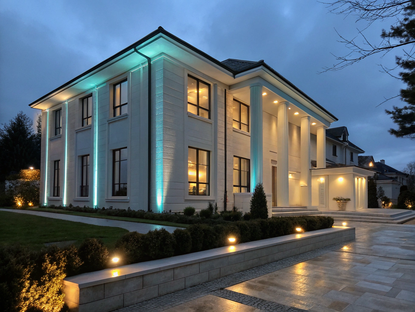 Luxury residence facade illuminated with warm architectural low-voltage LED uplighting